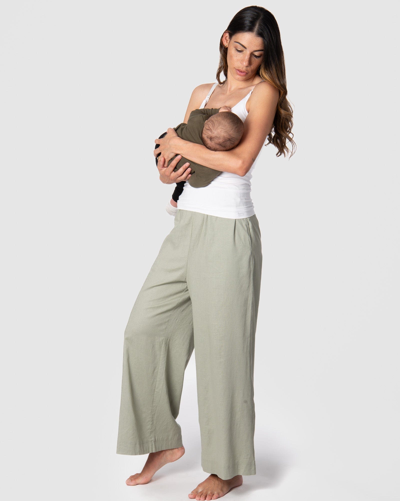 Kami, a mother of 2, loves the comfort of the new Hotmilk &#39;Sage Lounge Pant,&#39; paired with the Hotmilk My Necessity nursing cami, creating the ultimate postpartum lounge set. These pants are the embodiment of sumptuous comfort, featuring a soft waistband and a flattering 7/8 length that combines style and relaxation seamlessly. Discover the perfect loungewear for pregnancy breastfeeding and postpartum comfort with Hotmilk US&#39;s Sage Lounge Pant